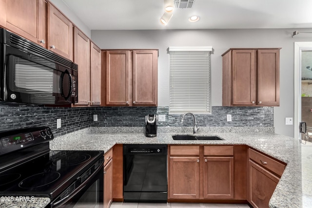 4043 E Carla Vista Dr, Gilbert, AZ 85295 - kitchen with black appliances, a sink, tasteful backsplash, and light stone counters