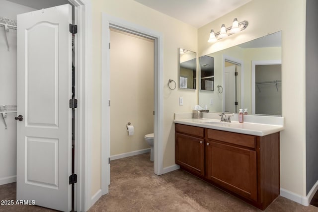 4043 E Carla Vista Dr, Gilbert, AZ 85295 - full bath featuring toilet, vanity, a spacious closet, and baseboards