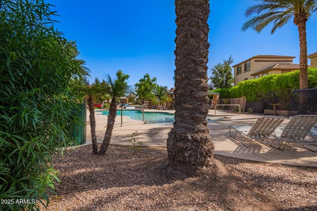 4043 E Carla Vista Dr, Gilbert, AZ 85295 - community pool featuring a patio area and fence