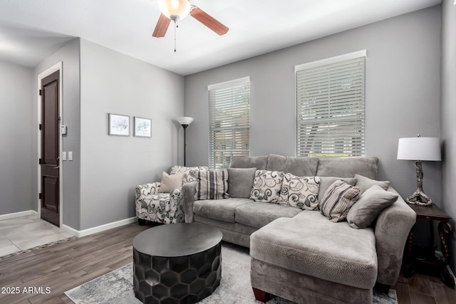 4043 E Carla Vista Dr, Gilbert, AZ 85295 - living area with light wood finished floors, a ceiling fan, and baseboards