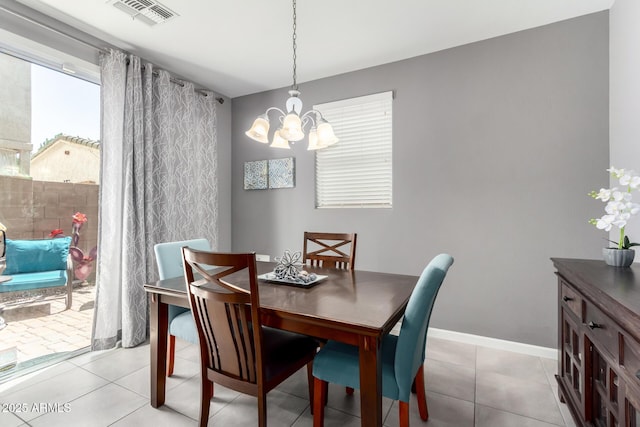 4043 E Carla Vista Dr, Gilbert, AZ 85295 - dining area featuring a chandelier, baseboards, and light tile patterned floors