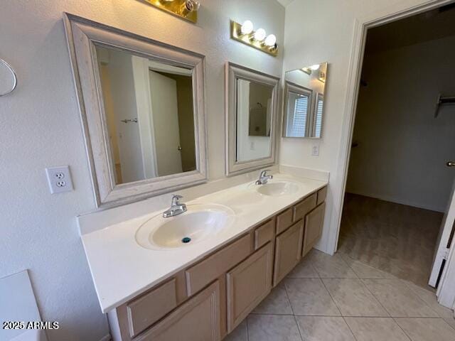 bathroom with vanity and tile patterned flooring