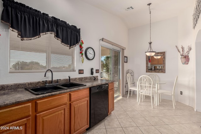 kitchen featuring sink, vaulted ceiling, black dishwasher, decorative light fixtures, and light tile patterned flooring