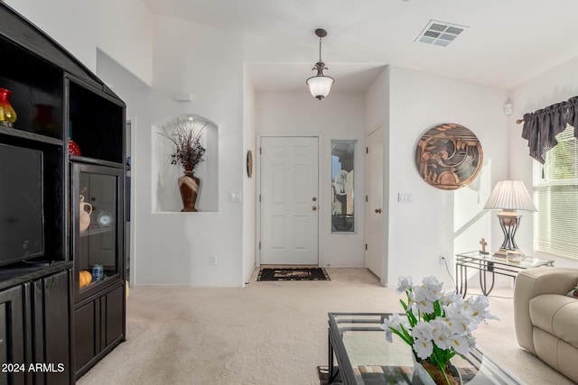 carpeted living room featuring lofted ceiling