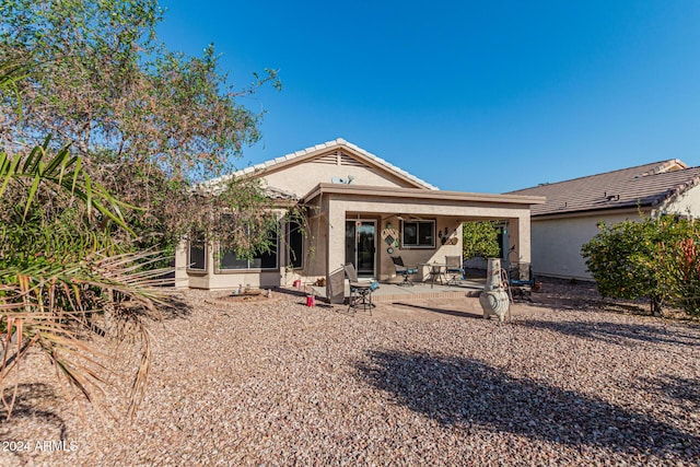 rear view of property with a patio area