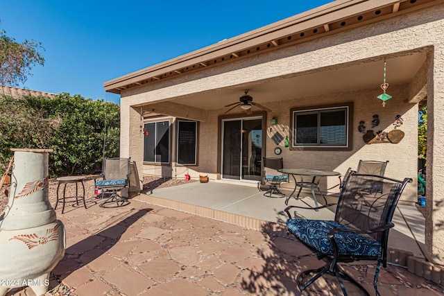 view of patio featuring ceiling fan