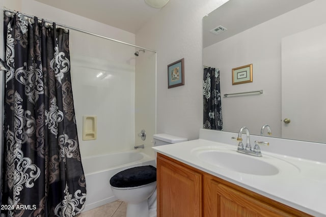 full bathroom featuring tile patterned flooring, shower / tub combo, vanity, and toilet