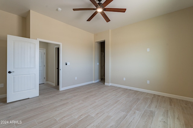 unfurnished bedroom with light wood-type flooring and ceiling fan