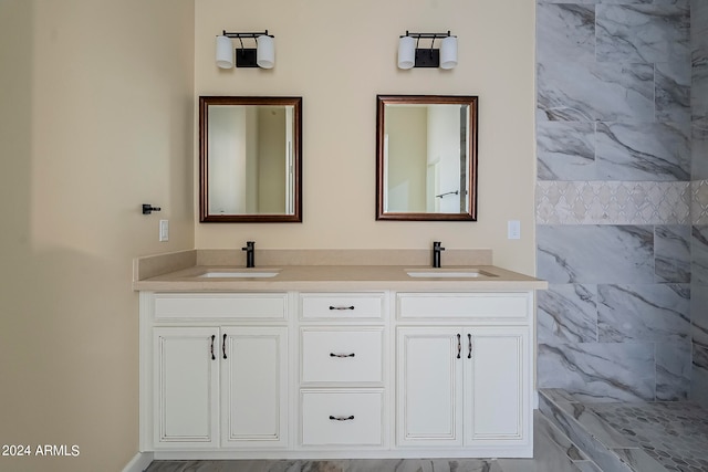 bathroom featuring vanity and tile walls