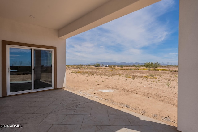 view of patio / terrace with a mountain view