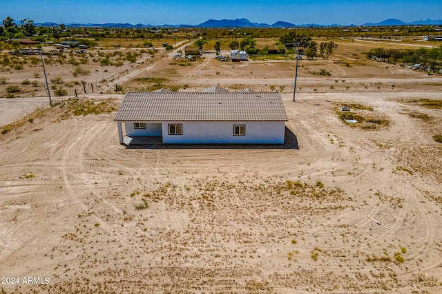 drone / aerial view featuring a mountain view