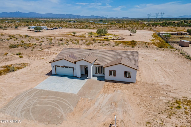 birds eye view of property featuring a mountain view