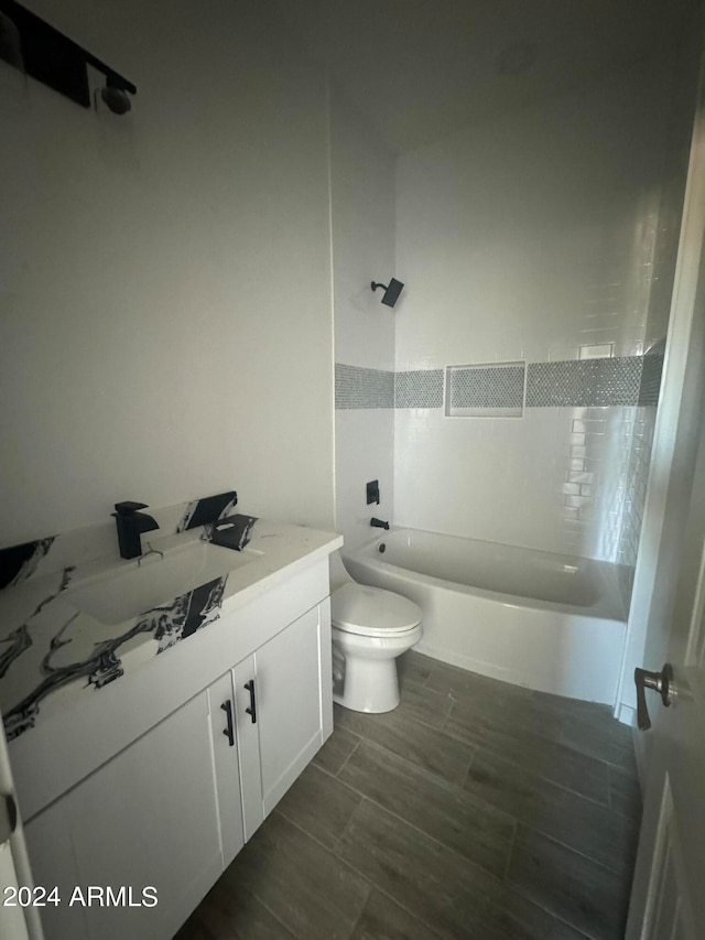 full bathroom featuring vanity, toilet, and bathing tub / shower combination