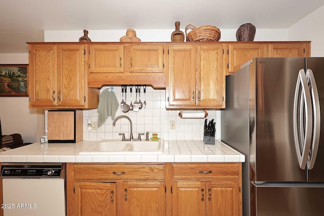 2619 W Lamar Rd, Phoenix, AZ 85017 - kitchen with freestanding refrigerator, a sink, light countertops, dishwasher, and tasteful backsplash