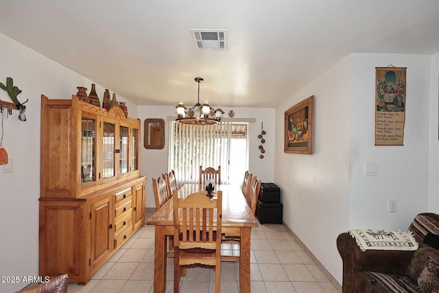2619 W Lamar Rd, Phoenix, AZ 85017 - dining space with light tile patterned floors, visible vents, and an inviting chandelier