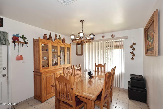 2619 W Lamar Rd, Phoenix, AZ 85017 - dining room featuring light tile patterned floors, visible vents, and a chandelier