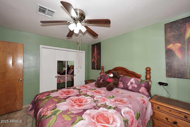 2619 W Lamar Rd, Phoenix, AZ 85017 - bedroom featuring tile patterned floors, visible vents, a closet, and ceiling fan