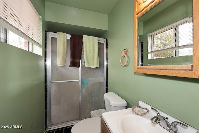 2619 W Lamar Rd, Phoenix, AZ 85017 - bathroom with a wealth of natural light, toilet, a stall shower, and vanity