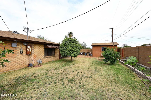2619 W Lamar Rd, Phoenix, AZ 85017 - view of yard with an outbuilding and fence