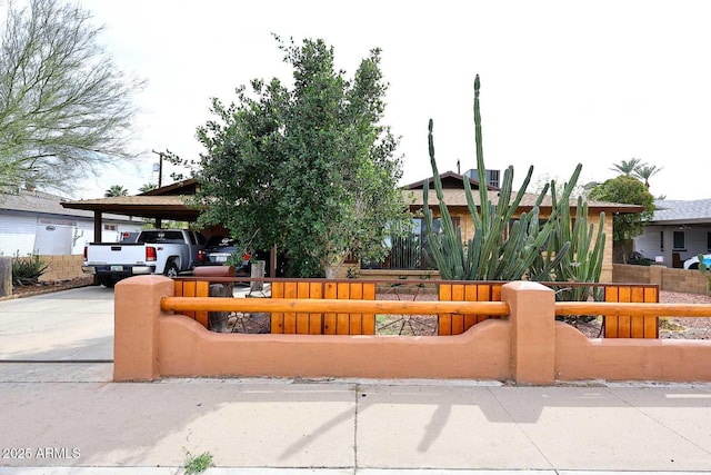 2619 W Lamar Rd, Phoenix, AZ 85017 - view of front of house with an attached carport, concrete driveway, and fence