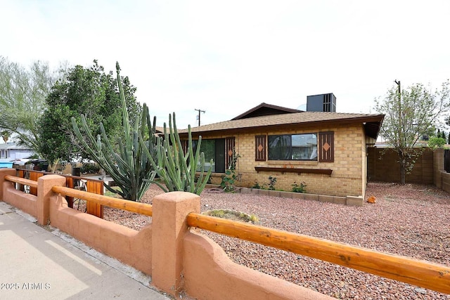 2619 W Lamar Rd, Phoenix, AZ 85017 - view of front of home featuring cooling unit, brick siding, and fence private yard