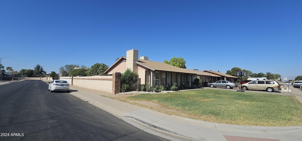 exterior space with a front lawn