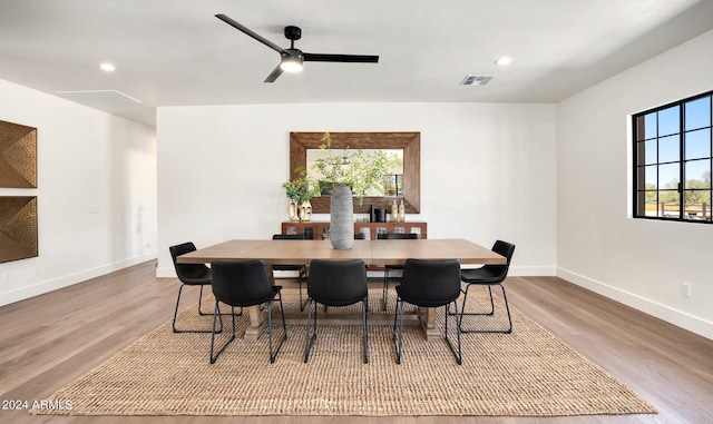 dining space featuring light hardwood / wood-style flooring, ceiling fan, and plenty of natural light