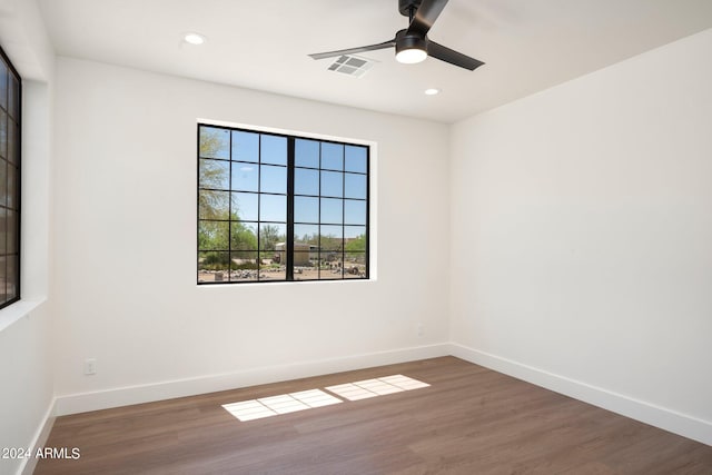 unfurnished room with hardwood / wood-style floors and ceiling fan