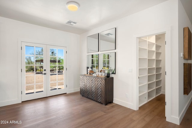 interior space featuring french doors and dark wood-type flooring