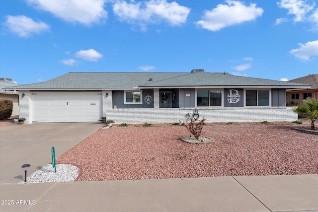 ranch-style house featuring a garage