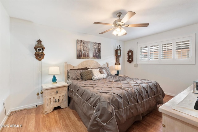 bedroom with hardwood / wood-style flooring and ceiling fan