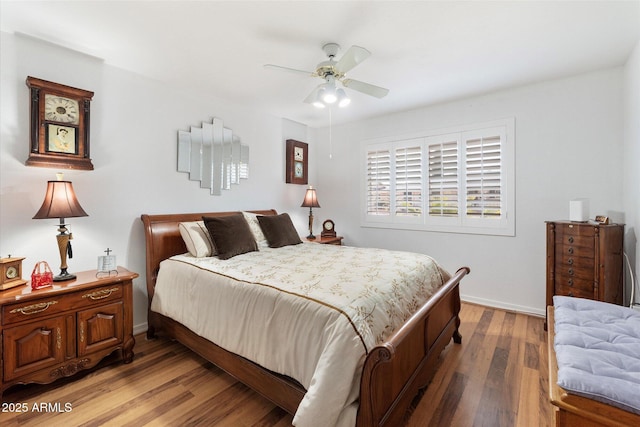 bedroom featuring hardwood / wood-style floors and ceiling fan