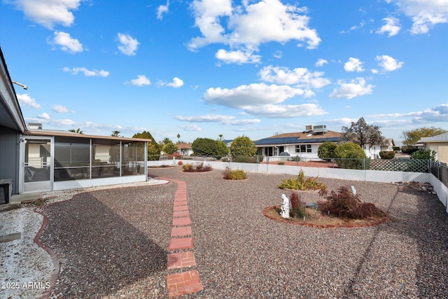 view of yard with a sunroom