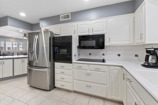 kitchen featuring light tile patterned floors, white cabinets, ceiling fan, and black appliances