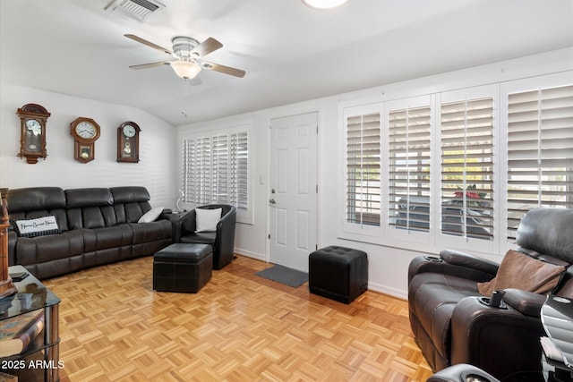 living room with light parquet flooring, vaulted ceiling, and ceiling fan