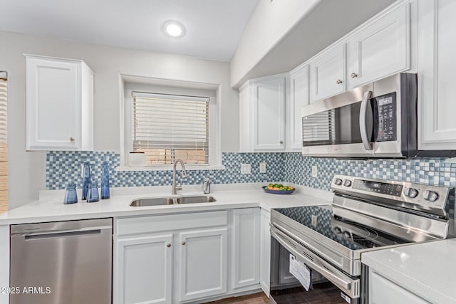 44853 W Jack Rabbit Trl, Maricopa, AZ 85139 - kitchen with appliances with stainless steel finishes, white cabinetry, light countertops, and decorative backsplash