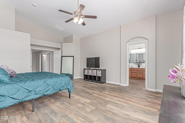 44853 W Jack Rabbit Trl, Maricopa, AZ 85139 - bedroom with light wood-style floors, high vaulted ceiling, ensuite bathroom, and a ceiling fan