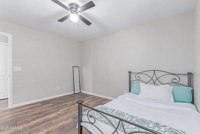 44853 W Jack Rabbit Trl, Maricopa, AZ 85139 - bedroom with wood finished floors and a ceiling fan