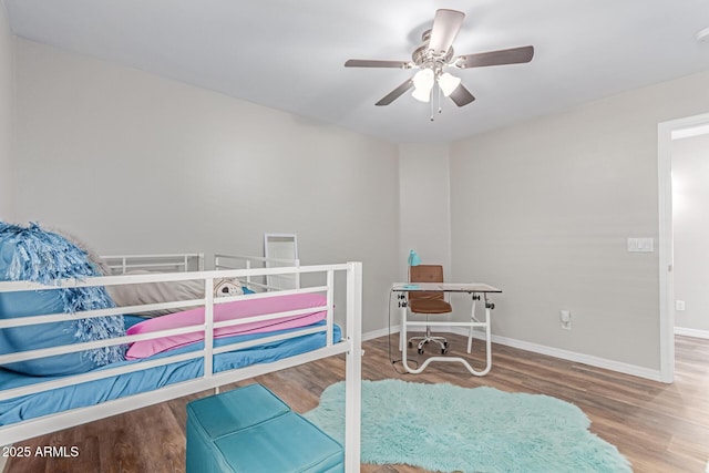 44853 W Jack Rabbit Trl, Maricopa, AZ 85139 - bedroom with wood finished floors and a ceiling fan
