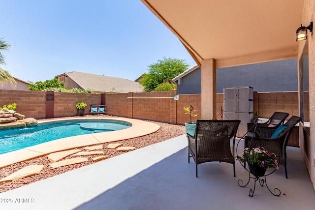 44853 W Jack Rabbit Trl, Maricopa, AZ 85139 - view of pool with a patio and a fenced backyard