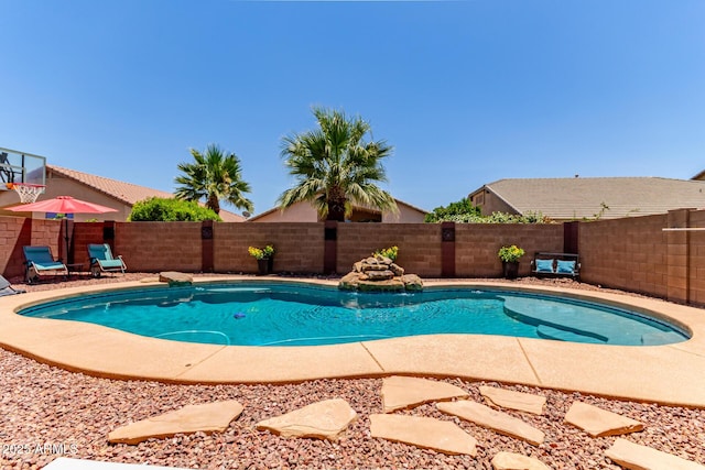 44853 W Jack Rabbit Trl, Maricopa, AZ 85139 - view of swimming pool with a fenced backyard