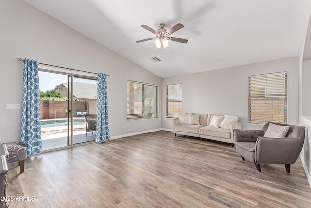 44853 W Jack Rabbit Trl, Maricopa, AZ 85139 - living area with lofted ceiling, a ceiling fan, and wood finished floors