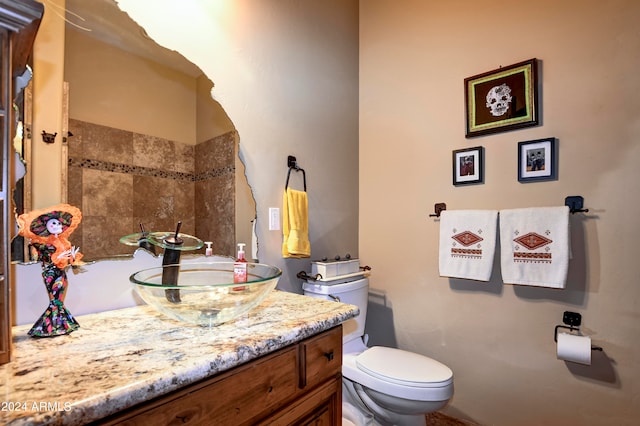 bathroom featuring toilet and vanity