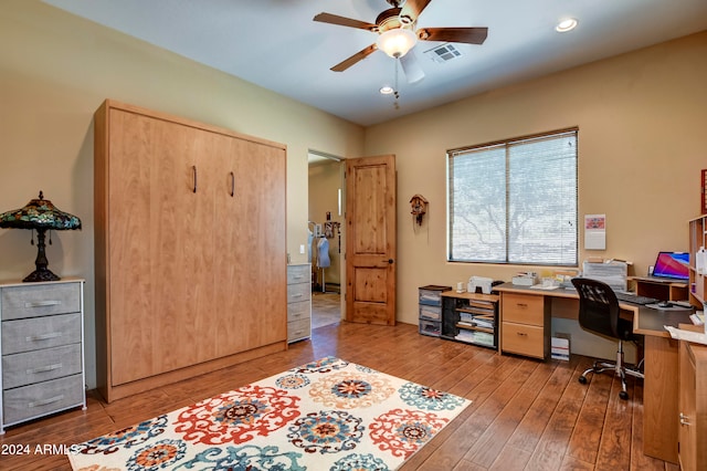 office space with light wood-type flooring and ceiling fan