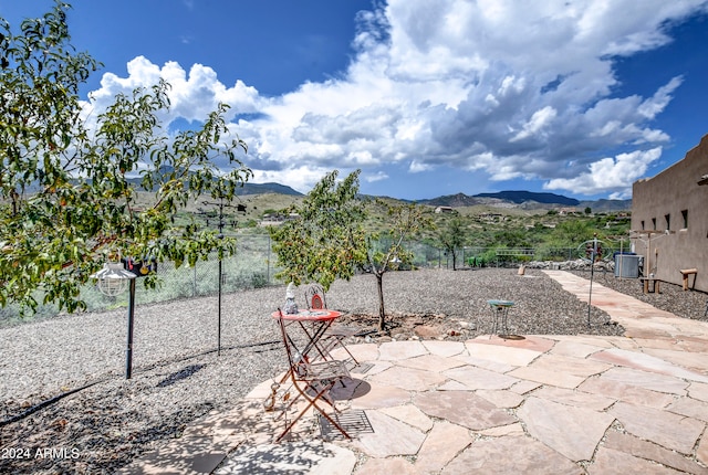 view of patio / terrace featuring a mountain view