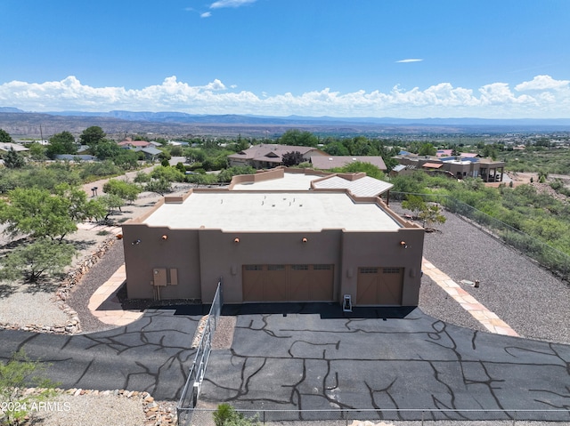 birds eye view of property featuring a mountain view