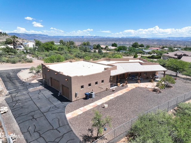 birds eye view of property featuring a mountain view