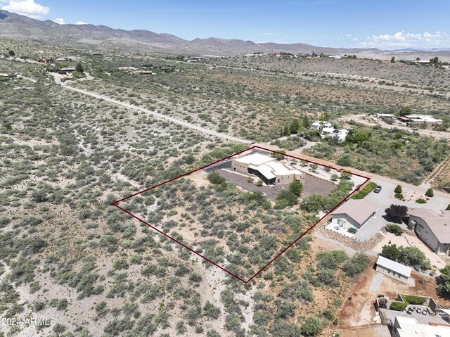 birds eye view of property featuring a mountain view