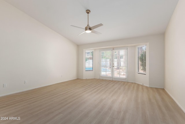 empty room with ceiling fan and light hardwood / wood-style floors