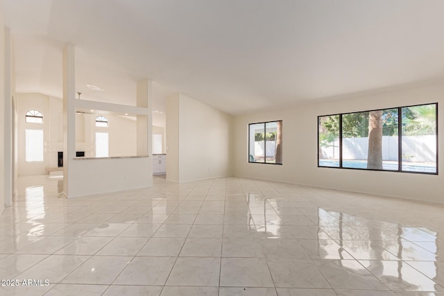 spare room featuring lofted ceiling